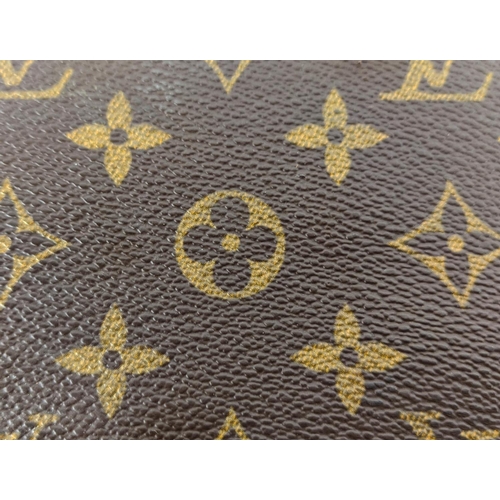 62 - LOUIS VUITTON CRUISER 45 TRAVEL BAG, monogram canvas and leather trims, name tag, ardillon buckle cl... 