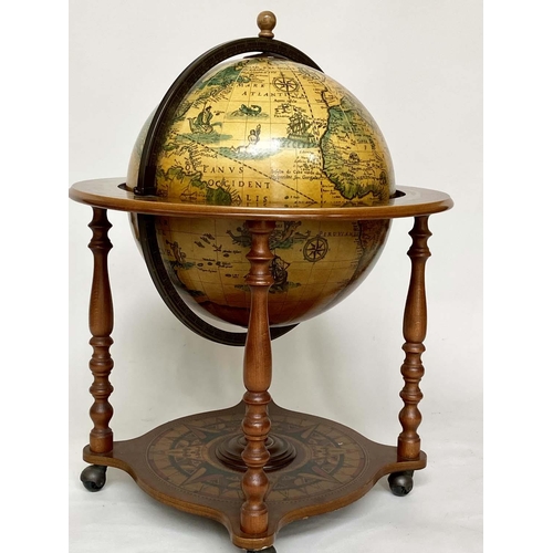 623 - GLOBE COCKTAIL CABINET, in the form of an antique terrestrial globe on stand with rising lid and fit... 