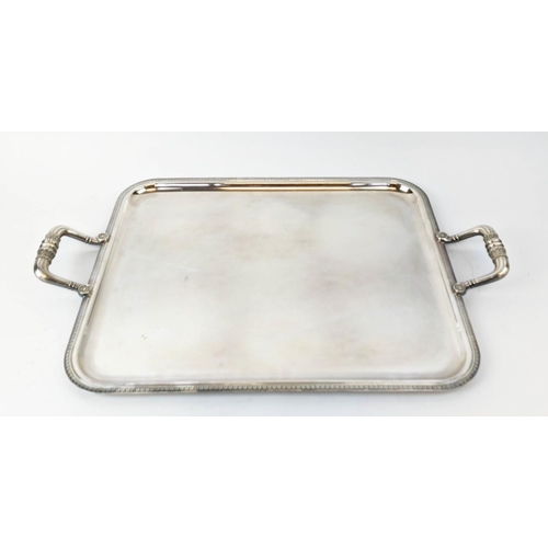 64 - TWO CHRISTOFLE SILVER PLATED TWIN HANDLED SERVING TRAYS, largest 60cm x 39cm, complete with cloth co... 