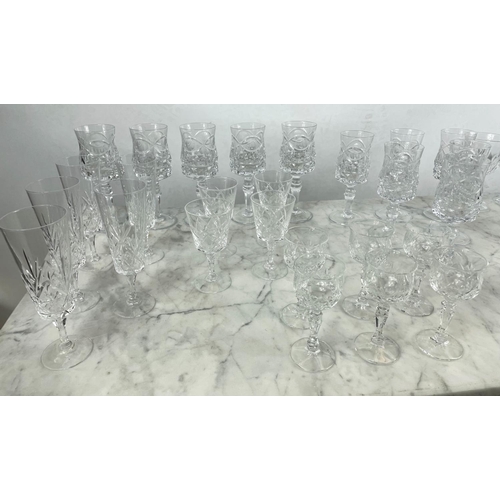 9 - A QUANTITY OF CUT GLASS, including six cut glass wine glasses, nine claret glasses, champagne flutes... 