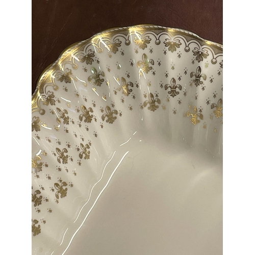 94 - SPODE 'FLEUR DE LYS GOLD' PART DINNER SERVICE, comprising ten plates, ten side plates, ten dessert b... 