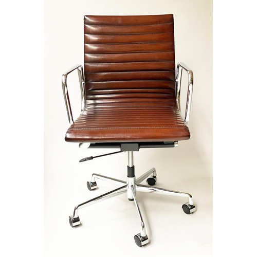 624 - AFTER CHARLES AND RAY EAMES ALUMINIUM GROUP CHAIR, ribbed tan leather seat, revolving and reclining ... 