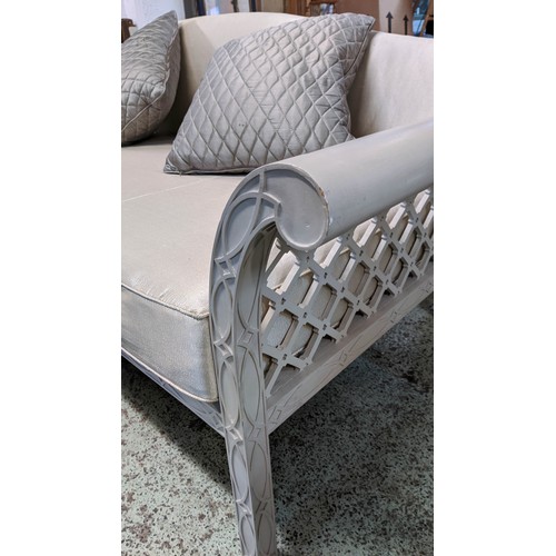 625 - CONSERVATORY SOFA, 92cm high, 250cm wide, 100cm deep, with grey painted lattice frame.