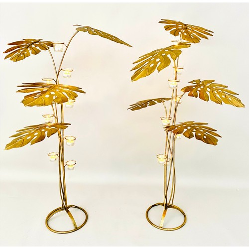 353 - FLOOR STANDING TEALIGHT CANDELABRAS, 131cm high, 70cm wide, a pair, Naturalistic form, in the manner... 