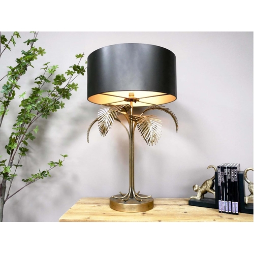 350 - PALM TREE TABLE LAMP, 74cm high, 45cm diameter, gilt frame black shade, battery powered.