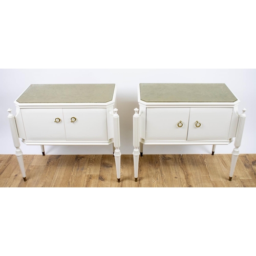 314 - BEDSIDE CABINETS, a pair, 59cm H x 70cm W x 39cm D, white lacquer each with gilt paper lined glass t... 