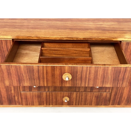 281 - GORDON RUSSELL SIDEBOARD, 1970s Indian Laurel with four centre drawers flanked by doors enclosing sh... 