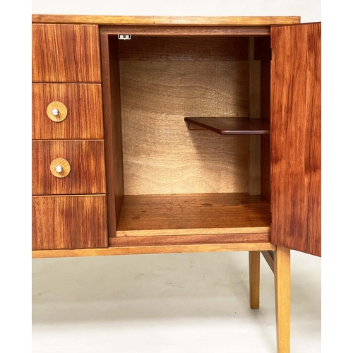 281 - GORDON RUSSELL SIDEBOARD, 1970s Indian Laurel with four centre drawers flanked by doors enclosing sh... 