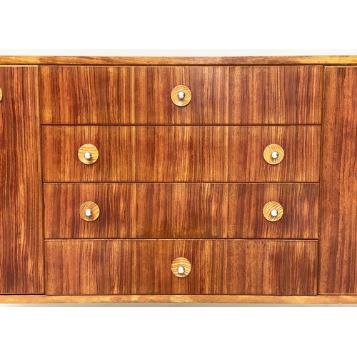 281 - GORDON RUSSELL SIDEBOARD, 1970s Indian Laurel with four centre drawers flanked by doors enclosing sh... 