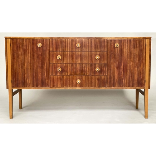 281 - GORDON RUSSELL SIDEBOARD, 1970s Indian Laurel with four centre drawers flanked by doors enclosing sh... 