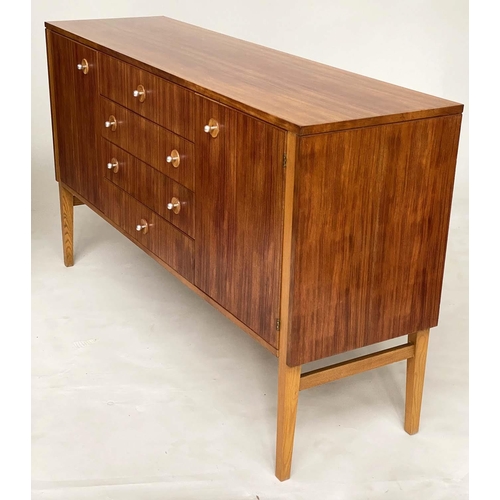 281 - GORDON RUSSELL SIDEBOARD, 1970s Indian Laurel with four centre drawers flanked by doors enclosing sh... 