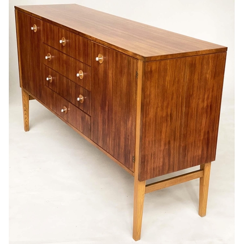 281 - GORDON RUSSELL SIDEBOARD, 1970s Indian Laurel with four centre drawers flanked by doors enclosing sh... 