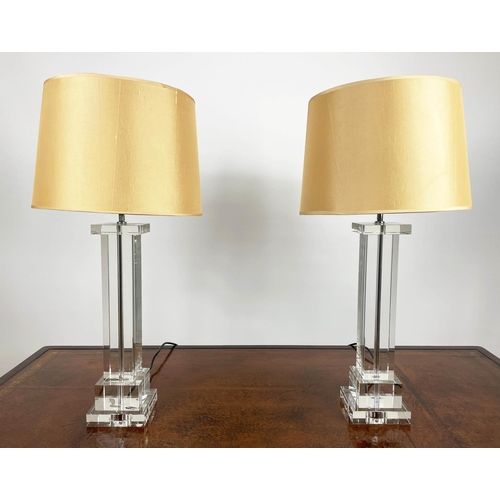 500 - TABLE LAMPS, a pair, clear glass columns with gold shades. (2)