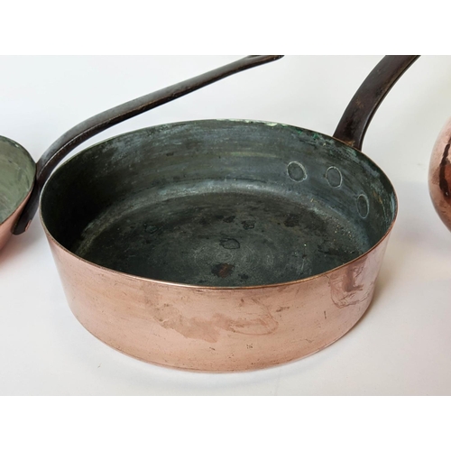 387 - BATTERIE DE CUISINE, comprising of a graduated set of five copper pans, the largest 31cm diam and tw... 