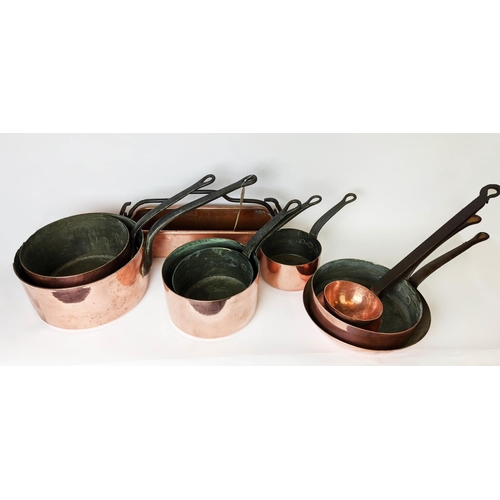 387 - BATTERIE DE CUISINE, comprising of a graduated set of five copper pans, the largest 31cm diam and tw... 