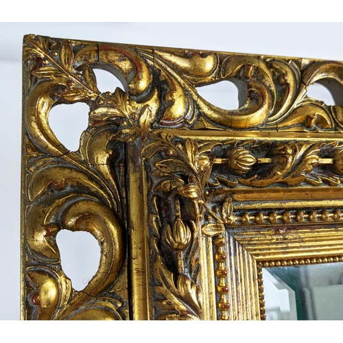 414 - WALL MIRROR, 185cm x 125cm, with a decorative pierced frame and bevelled plate.