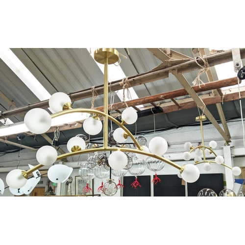 396 - CEILING LIGHTS, a pair, 1950s Italian style, each twelve branch, gilt metal frosted ball shades, 60c... 