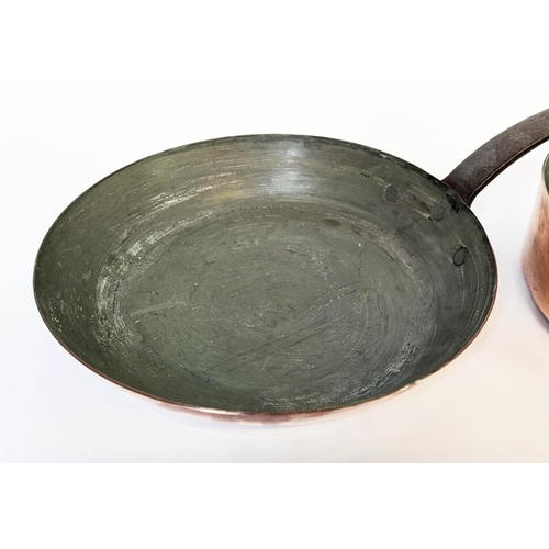 387 - BATTERIE DE CUISINE, comprising of a graduated set of five copper pans, the largest 31cm diam and tw... 