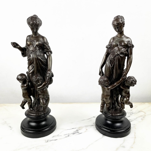 10 - MAIDENS WITH CHILDREN, a pair, spelter, 36cm H. (2)