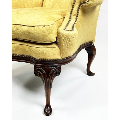 107 - WING ARMCHAIR, 112cm H x 98cm W, Queen Anne style, walnut, in yellow fabric.