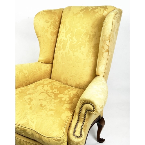 107 - WING ARMCHAIR, 112cm H x 98cm W, Queen Anne style, walnut, in yellow fabric.