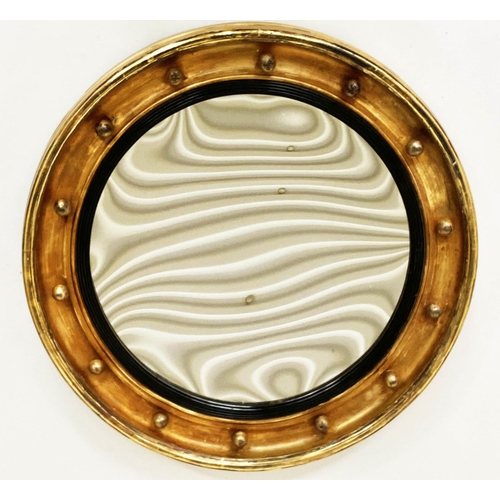 121 - CONCAVE WALL MIRROR, 19th century circular giltwood and ball encrusted with slightly concave mirror ... 