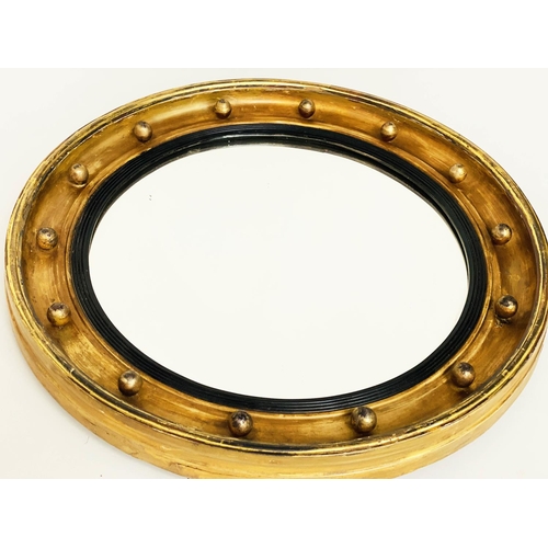 121 - CONCAVE WALL MIRROR, 19th century circular giltwood and ball encrusted with slightly concave mirror ... 