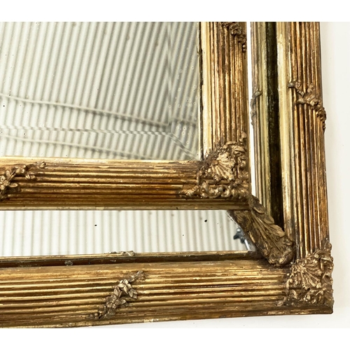 136 - WALL MIRROR, late 19th century French giltwood and gesso with reeded and floral cushion frame, aroun... 