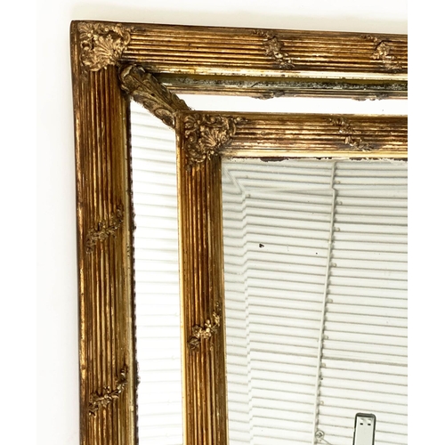 136 - WALL MIRROR, late 19th century French giltwood and gesso with reeded and floral cushion frame, aroun... 