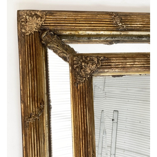 136 - WALL MIRROR, late 19th century French giltwood and gesso with reeded and floral cushion frame, aroun... 