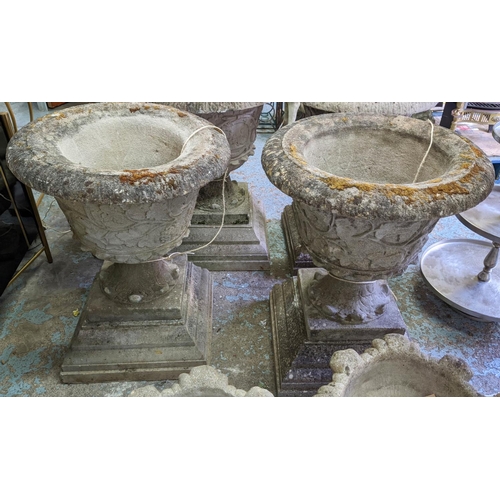 173 - GARDEN URNS, a pair, each 66cm W x 85cm H, in weathered reconstituted stone. (2)