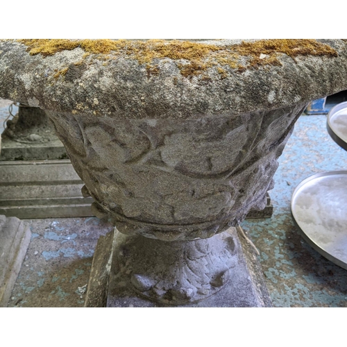 173 - GARDEN URNS, a pair, each 66cm W x 85cm H, in weathered reconstituted stone. (2)