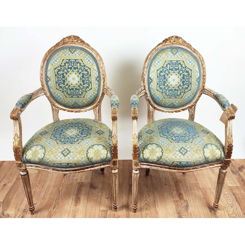 192 - FAUTEUILS, a pair, each 60cm x 101cm H, Louis XVI style with carved showframes and gilt detail in Ve... 