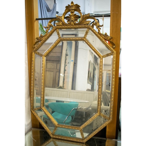 212 - WALL MIRROR, 144cm H x 89cm, French style giltwood with marginal plates and foliage crest.