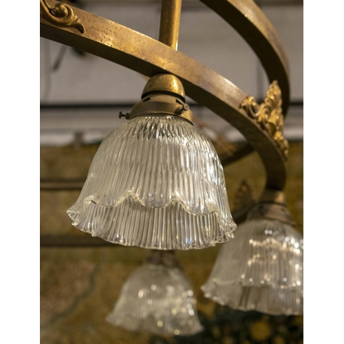 213 - HANGING LIGHT, early 20th century brass with eight glass shades, 112cm x 29cm H excluding chain.