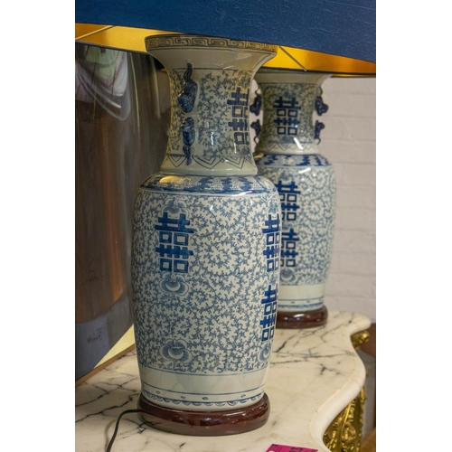 218 - TABLE LAMPS, 92cm H x 61cm, a pair, Chinese blue and white ceramic with blue shades. (2) (loose fitt... 