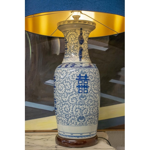 218 - TABLE LAMPS, 92cm H x 61cm, a pair, Chinese blue and white ceramic with blue shades. (2) (loose fitt... 