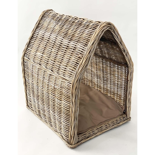 295 - DOG BED, woven heavy duty rattan, arched with cushion, 72cm x 82cm H x 60cm.