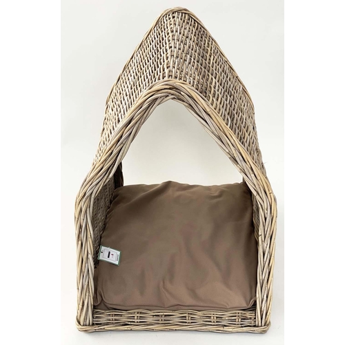 295 - DOG BED, woven heavy duty rattan, arched with cushion, 72cm x 82cm H x 60cm.