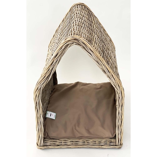 295 - DOG BED, woven heavy duty rattan, arched with cushion, 72cm x 82cm H x 60cm.