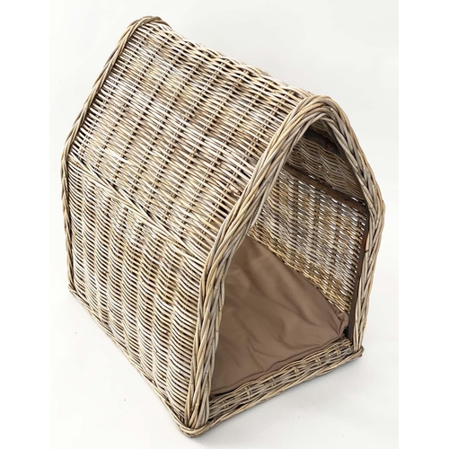 295 - DOG BED, woven heavy duty rattan, arched with cushion, 72cm x 82cm H x 60cm.