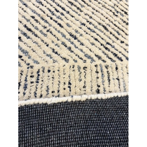 309 - CONTEMPORARY CARPET, 305cm x 242cm.