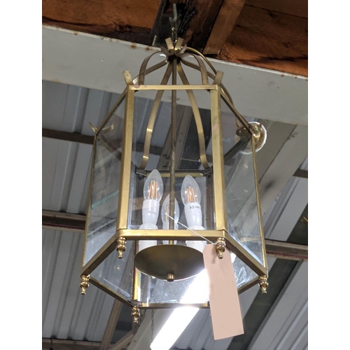 319 - HALL LANTERN, gilt metal and glazed, three branch light, 65cm H. (faults to finish)