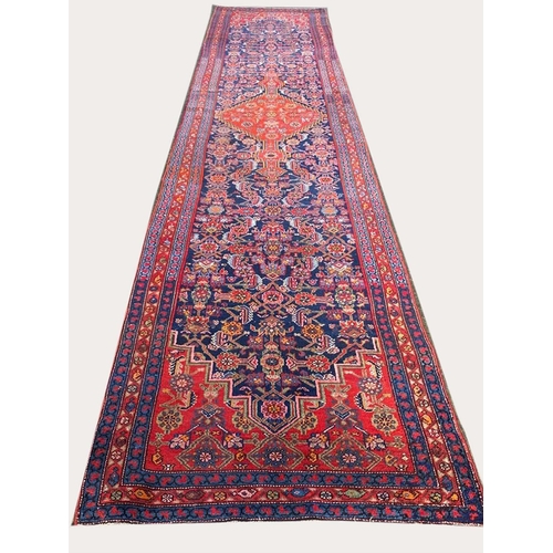 89 - ANTIQUE NORTH WEST PERSIAN RUNNER, 490cm x 103cm.