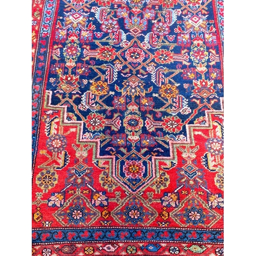 89 - ANTIQUE NORTH WEST PERSIAN RUNNER, 490cm x 103cm.