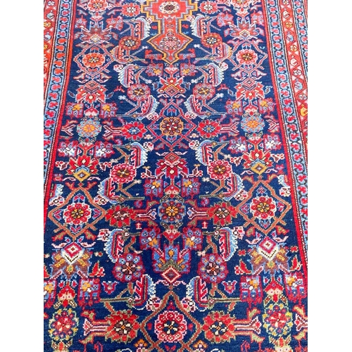 89 - ANTIQUE NORTH WEST PERSIAN RUNNER, 490cm x 103cm.