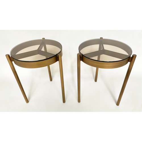 286 - SIDE TABLES, a pair, bronzed steel circular glazed each with three supports, 42cm x 59cm H. (2)