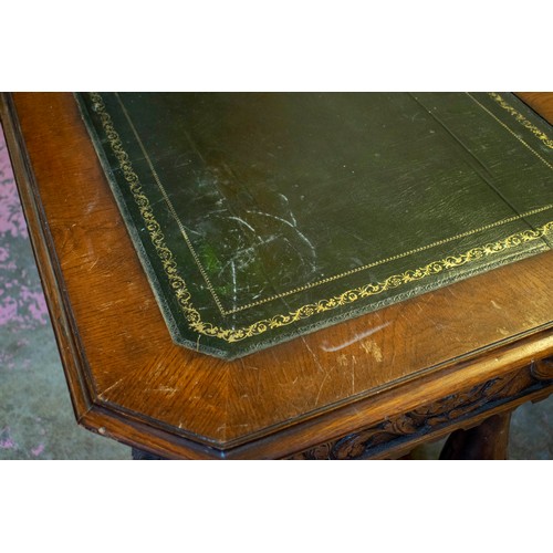 243 - CENTRE WRITING TABLE, 73cm H x 133cm x 71cm, late Victorian carved oak with green leather top above ... 