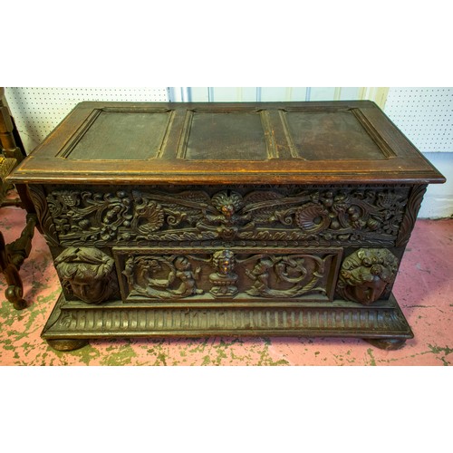 242 - COFFER, 64cm H x 124cm x 64cm, Victorian oak with hinged top and heavily carved front.