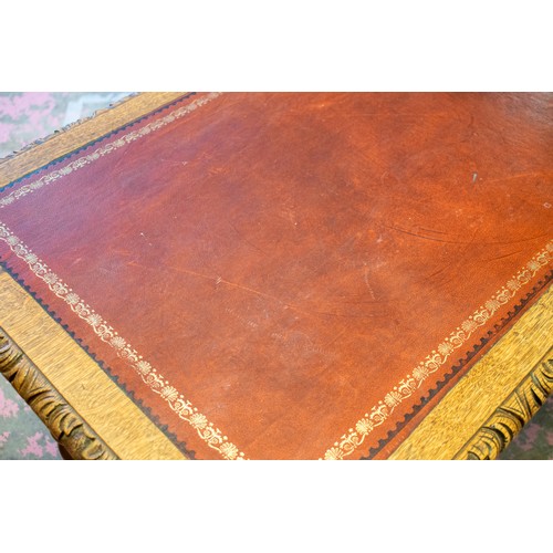 241 - CENTRE WRITING TABLE, 74cm H x 123cm x 68cm, late Victorian carved oak with red leather top above tw... 